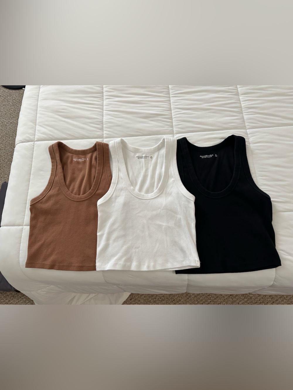 3 A&F women’s essential ribbed tank tops, M, white, black, and brown